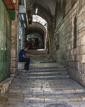 Israel, Jerusalem, The ancient stairs of the narrow Via Dolorosa in the Muslim Quarter of the Old City. The Old City of Jerusalem and its Walls is a UNESCO World Heritage Site.