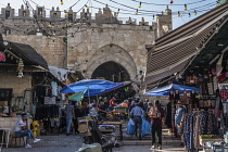 Israel, Jerusalem, Shoppers in the street market by the Damascus Gate in the Muslim Quarter of the Old City of Jerusalem. The Old City of Jerusalem and its Walls is a UNESCO World Heritage Site.