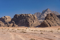 Jordan, Wadi Rum Protected Area, Tourists on a 4WD adventure in the desert sand and mountains in the Wadi Rum Protected Area, a UNESCO World Heritage Site. Um Sahn sandstone .