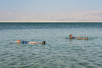 Israel, Ein Bokek, Dead Sea, Two women relax and float in the warm, bouyant waters of the Dead Sea at the resort of Ein Bokek in Israel.