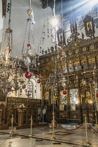 Palestine, Bethlehem, Icons, sanctuary lamps and the main iconostasis in the apse of the Church of the Nativity in Bethlehem in the Occupied West Bank. The original basilica was built in 339 A.D. over...