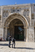 Israel, Jerusalem, Israeli security police stand in front of the facade of the al-Aqsa Mosque on the Temple Mount or al-Haram ash-Sharif in the Old City. The Temple Mount is often the site of conflict...