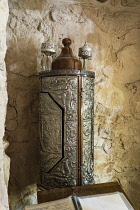Israel, A sterling silver Torah case in the ruins of the fortress of Masada in the Judean Desert of Israel. Masada National Park in a UNESCO World Heritage Site.