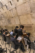 Israel, Jerusalem, Western Wall, Jewish men worship in the synagogue under Wilson's Arch at the Western Wall of the Temple Mount in the Jewish Quarter of the Old City. The Old City of Jerusalem and it...