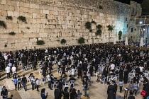 Israel, Jerusalem, Western Wall, Jewish men worship at the Western Wall of the Temple Mount in the Jewish Quarter of the Old City. The Old City of Jerusalem and its Walls is a UNESCO World Heritage Si...