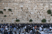 Israel, Jerusalem, Western Wall, Jewish men worship at the Western Wall of the Temple Mount in the Jewish Quarter of the Old City. The Old City of Jerusalem and its Walls is a UNESCO World Heritage Si...