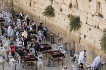 Israel, Jerusalem, Western Wall, Jewish men worship at the Western Wall of the Temple Mount in the Jewish Quarter of the Old City. The Old City of Jerusalem and its Walls is a UNESCO World Heritage Si...