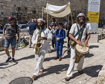 Israel, Jerusalem, Jewish Quarter, Musicians lead the procession before a bar mitzvah ceremony in the Jewish Quarter of the Old City. The Old City of Jerusalem and its Walls is a UNESCO World Heritage...