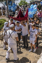 Israel, Jerusalem, Jewish Quarter, A bar mitzvah procession moves toward the entrance to the Jewish Quarter of the Old City.