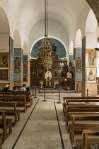 Jordan, Madaba, The nave and iconostasis in St. Georges Church, a Greek Orthodox church. The famous Madaba Map of the Holy Land, circa 560 A.D., is surrounded by the chains.