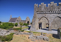 Ireland, County Kerry, Ardfert, Ruins of 12th century Ardfert Cathedral with Temple na  Hoe and Temple na Griffin in the background.