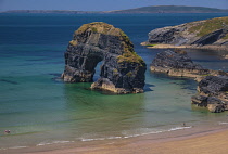 Ireland, County Kerry, Ballybunion, Nuns Beach, sea arch known as Virgin Rock.