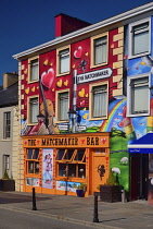 Ireland, County Clare, Lisdoonvarna, Colourful romance based artwork surrounding the Matchmaker Bar relating to the towns annual Matchmaker festival held every September.