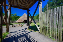 Ireland, County Clare, Quin, Craggaunowen, The Living Past Experience, Reconstruction of a crannog with wooden fenced pathway leading in to settlement area.