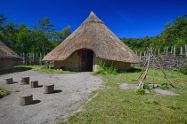 Ireland, County Clare, Quin, Craggaunowen, The Living Past Experience, Reconstruction of a crannog with thatched huts in the settlement area.