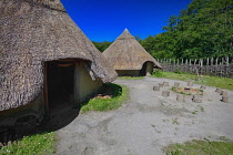 Ireland, County Clare, Quin, Craggaunowen, The Living Past Experience, Reconstruction of a crannog with thatched huts in the settlement area.