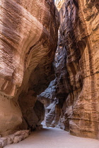 Jordan, Petra, The narrow slot canyon called the Siq leads to the ruins of the Nabataean city of Petra in the Petra Archeological Park is a Jordanian National Park and a UNESCO World Heritage Site.