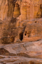 Jordan, Petra, A tomb carved in the wall of the narrow slot canyon called the Siq which leads to the ruins of the Nabataean city of Petra in the Petra Archeological Park is a Jordanian National Park and a UNESCO World Heritage Site.