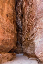 Jordan, Petra, The narrow slot canyon called the Siq leads to the ruins of the Nabataean city of Petra in the Petra Archeological Park is a Jordanian National Park and a UNESCO World Heritage Site. In...