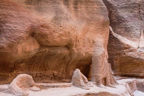 Jordan, Petra, Statues carved in the wall of the narrow slot canyon called the Siq which leads to the ruins of the Nabataean city of Petra in the Petra Archeological Park is a Jordanian National Park...