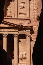 Jordan, Petra, The first view of of the ruins of Al Khazneh or the Treasury in the narrow slot canyon called the Siq which leads to the ruins of the Nabataean city of Petra in the Petra Archeological...