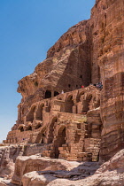 Jordan, Petra, Tourists on the stone arches and stairways below the Urn Tomb, a Royal Tomb in the ruins of the Nabataean city of Petra in the Petra Archeological Park in the A UNESCO World Heritage Si...