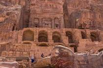 Jordan, Petra, Tourists on the stone arches and stairways below the Urn Tomb, a Royal Tomb in the ruins of the Nabataean city of Petra in the Petra Archeological Park in the A UNESCO World Heritage Si...