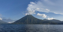 Guatemala, Solola Department, Lake Atitlan with San Pedro Volcano and the town of San Pedro la Laguna at its base.  Lake Atitlan is a giant volcanic crater or caldera filled with water.