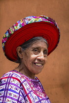 Guatemala, Solola Department, Santiago Atitlan, An older Mayan woman wears traditional dress, including a tocoyal or head wrap.  They are a symbol of status and authority for a woman.Twenty-five years...