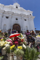 Guatemala, El Quiche Department, Chichicastenango, Vendors sell flowers on the steps of the Church of Santo Tomas. The church was built about 1545 A.D. on the platform of a Mayan pyramid.