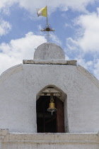Guatemala, Solola Department, Santa Cruz la Laguna, The facade and belfry of the simple parish church.  Behind is the village school.