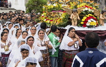 Guatemala, Solola Department, San Pedro la Laguna, Women carry the image of the Virgin  in the Catholic procession of the Virgin of Carmen.
