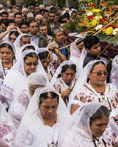 Guatemala, Solola Department, San Pedro la Laguna, Catholic procession of the Virgin of Carmen. Women in traditional Mayan dress with white mantillas over their heads.