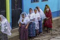 Guatemala, Solola Department, San Pedro la Laguna, Catholic procession of the Virgin of Carmen. Women in traditional Mayan dress with white mantillas over their heads.