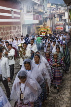 Guatemala, Solola Department, San Pedro la Laguna, Women carry the image of the Virgin in the Catholic procession of the Virgin of Carmen.