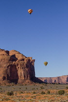 USA, Arizona, Monument Valley, A hot air balloon flying during Balloon Festival in the Navajo Tribal Park.