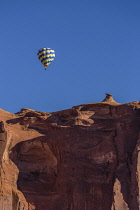 USA, Arizona, Monument Valley, Hot air balloons during Balloon Festival fly over the Navajo Tribal  Park.