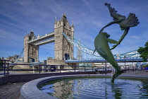 England, London, View of Tower Bridge and the sculpture known as Girl with a Dolphin created by David Wynne in 1973.