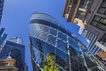 England, London, The Swiss Re building 30 St Mary Axe, alternatively known as the Gherkin, commercial skyscraper designed by architect Sir Norman Foster and opened in April 2004.