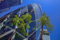 England, London, The Swiss Re building 30 St Mary Axe, alternatively known as the Gherkin, commercial skyscraper designed by architect Sir Norman Foster and opened in April 2004.