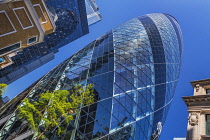 England, London, The Swiss Re building 30 St Mary Axe, alternatively known as the Gherkin, commercial skyscraper designed by architect Sir Norman Foster and opened in April 2004.