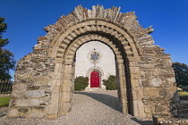 Republic of Ireland, County Kildare, Castledermot, Romanesque doorway in front of St James Church which is Church of Ireland.