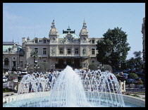 Monaco, Monte Carlo, Casino facade with fountain in the foreground.