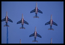 Transport, Air, Jets, Biggin Hill.  Patrouille de France  French air force display team flying in formation leaving blue smoke trails.