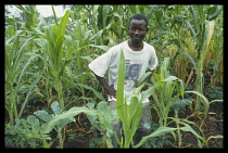 Kenya, Chichila, Gordon Orwa with organic crops on his shamba or small holding,  he trained in organic farming techniques whilst in prison.