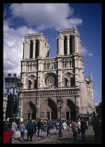 France, Ile de France , Paris, Notre Dame Cathedral  exterior facade with crowds of people in foreground.