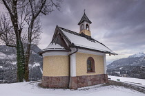 Germany, Bavaria, Berchtesgaden, The Chapel of the Beatitudes above the town on Lockstein Hill, rear view with the church surrounded by snow.