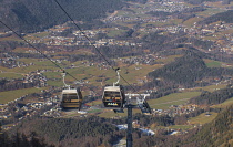 Germany, Bavaria, Berchtesgaden, Berchtesgadener Alps, Jennerbahn gondolas in transit to the summit of the Jenner Mountain.