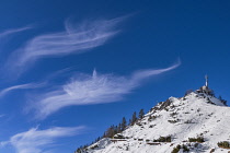 Germany, Bavaria, Berchtesgaden, Cloud patterns in clear blue sky as seen from the summit of the Jenner Mountain.