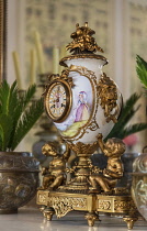 Ireland, County Galway, Connemara, Kylemore Abbey, Drawing Room with an ornate clock on the fine Italian marble fireplace.